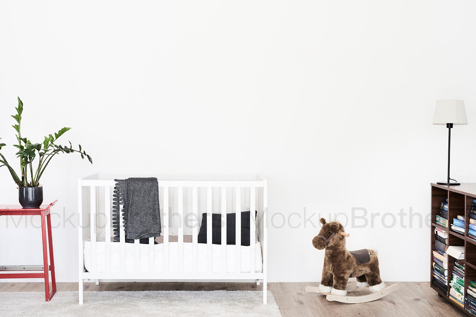 Nursery room with blank white wall by MockupBrothers